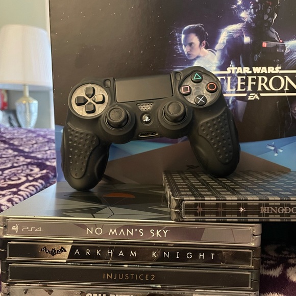 PS4 Slim with 2 extra controllers (diamond white) & (sapphire blue) + games.